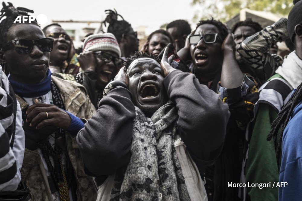 Baye Fall followers chant during a celebration as they return from the Great Mosque in Touba to the house of Sheik Ndiguel Fall, a local marabout