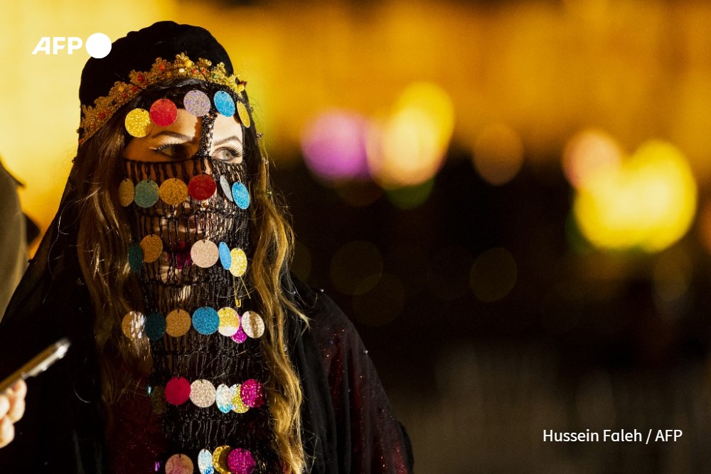 Members of a folk dance troupe prepare to perform to animate evenings during the Muslim holy fasting month of Ramadan