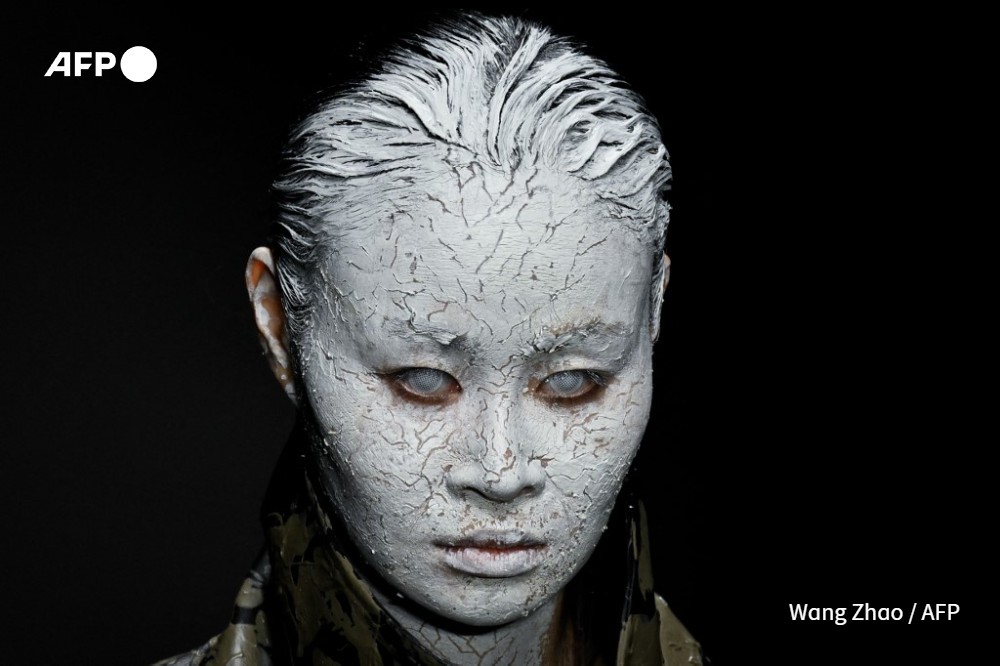 A model displays a creation from the Mi&amp;Go collection by Long Jing during China Fashion week in Beijing 