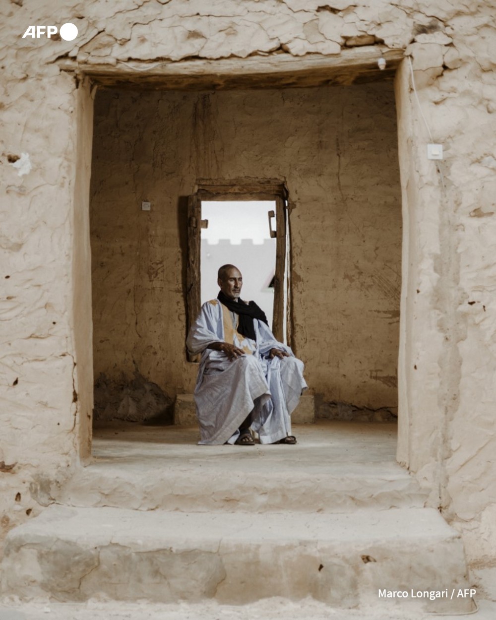 Abdullah Habbot, 45, poses for a portrait at his library, founded by his family over 200 years ago, in Chinguetti, on March 16, 2023.