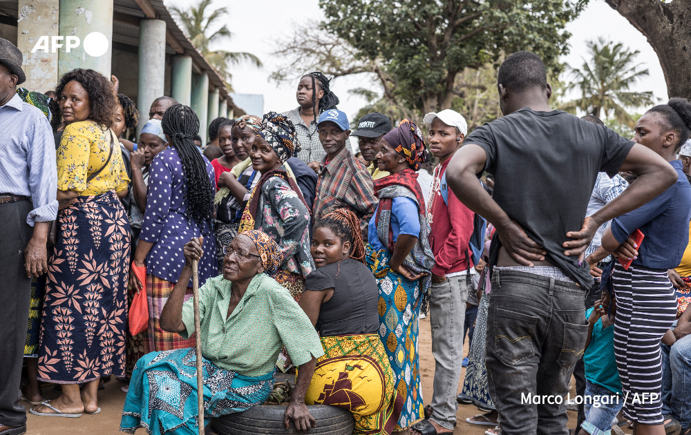 Voters gather in the courtyard of a polling station in the Escola Primaria Compleda Unidade 25 in the Polana Caniso district of Maputo on October 9, 2024 during Mozambique's national election. 
