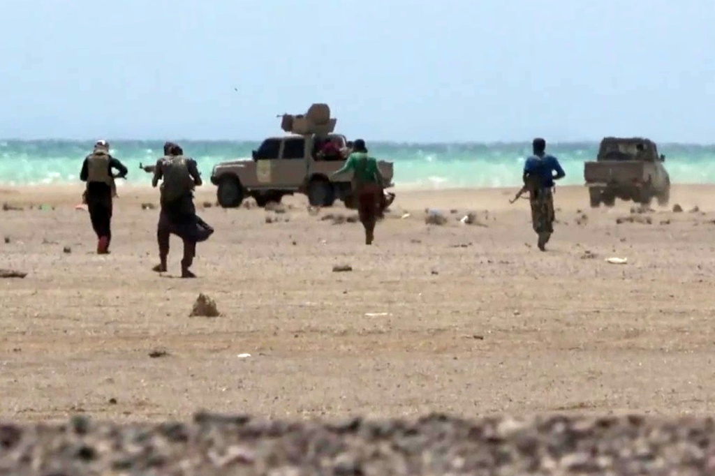 This screen grab taken from video footage released by the pro-Yemeni government Southern Giants Brigades on October 6 reportedly shows fighters near the Red Sea shore in Taiz province — - / AFP