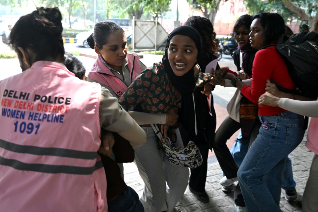 Police personnel detain supporters of the Cockroach Janta Party movement during a protest demanding the resignation of India's chief election commissioner — Arun SANKAR / AFP