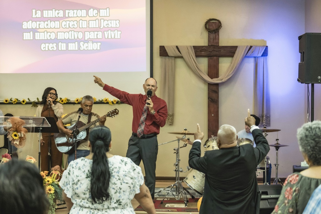 The rightward shift among Latino voters in recent years has been undermpinned by greater religiosity in the community — Olivier Touron / AFP
