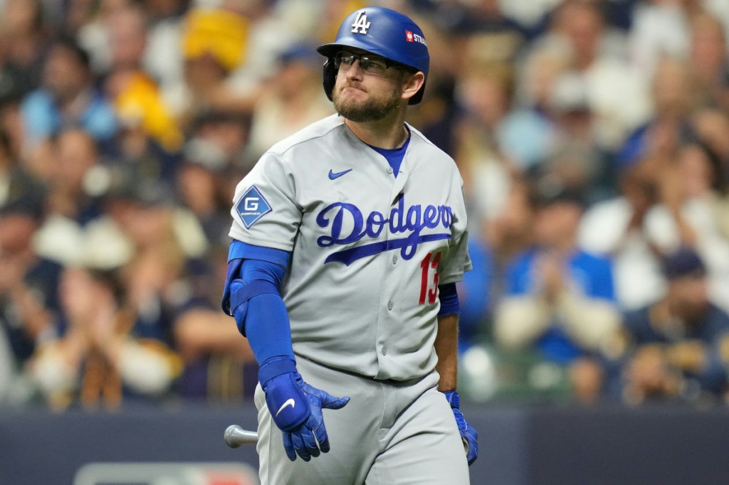 Max Muncy of the Los Angeles Dodgers walks to the dugout after striking out in the team's loss to the Milwaukee Brewers in game one of the National League Championship Series — John Fisher