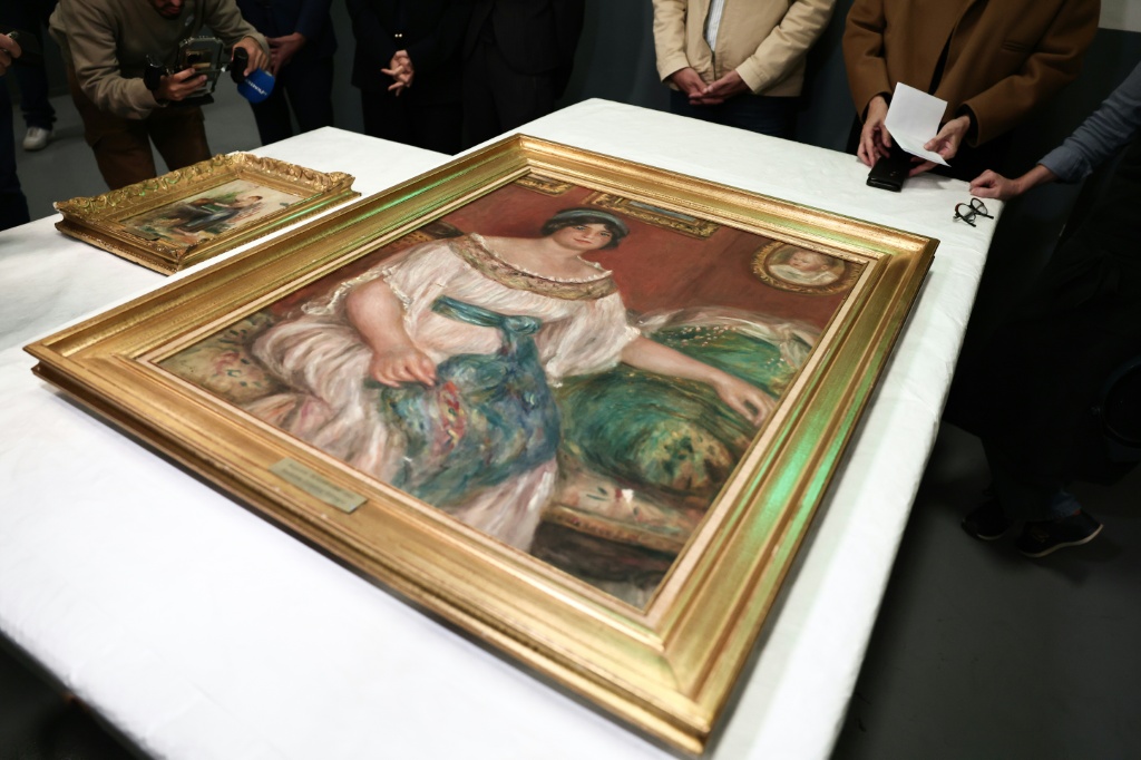Stolen Renoir paintings found behind wall in France