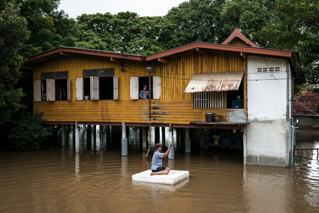 Scientists say human-made climate change has made heavy rain and floods more frequent and severe — Chanakarn LAOSARAKHAM / AFP