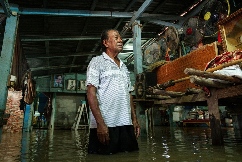 Residents say floods that once reached their knees now rise above their heads in some areas and can take months to recede — Chanakarn LAOSARAKHAM / AFP