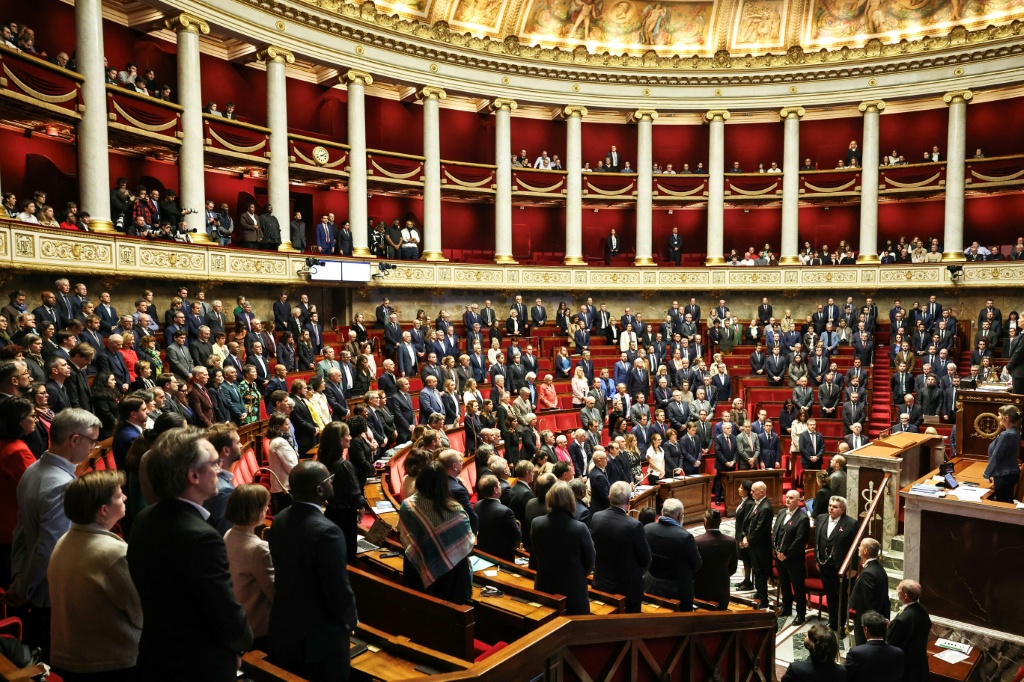 French lawmakers observed a minute of silence to pay tribute to the victims of last week's shooting attack — SIMON WOHLFAHRT / AFP