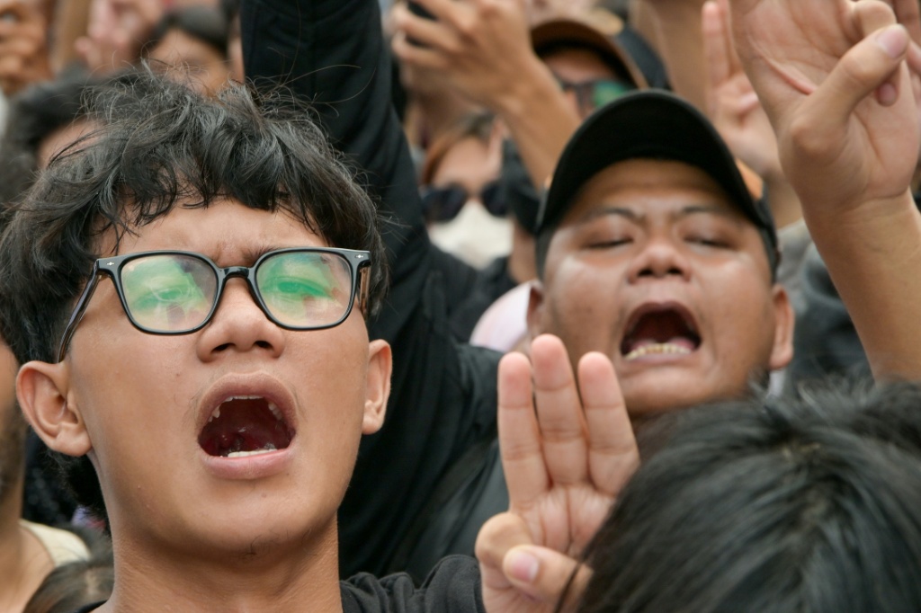 Many demonstrators held up the three-finger salute of rebellion from dystopian franchise 'The Hunger Games' — BAY ISMOYO / AFP