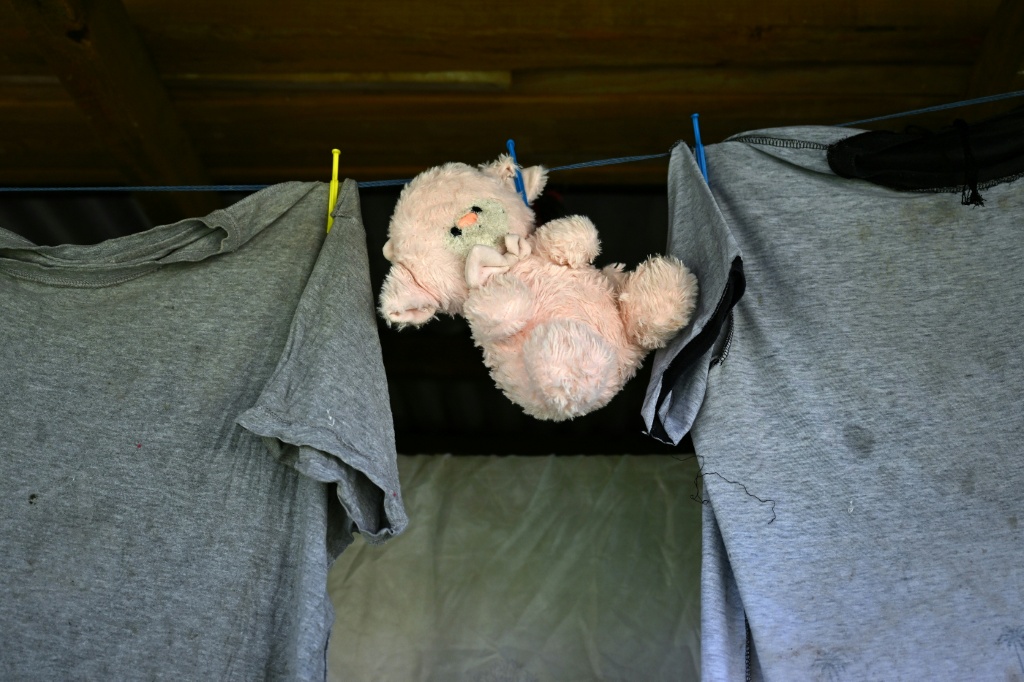 This photo taken on October 9, 2026 shows a soft toy hanging on a clothes line in Rukurukulevu village. The settlement of about 400 people finally electrified its last building this year -- a kindergarten, just metres from the sea. — Saeed KHAN / AFP