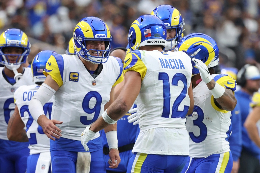 Los Angeles Rams quarterback Matthew Stafford celebrates a touchdown with teammate Puka Nacua in the Rams' NFL victory over the Las Vegas Raiders — Ian Maule
