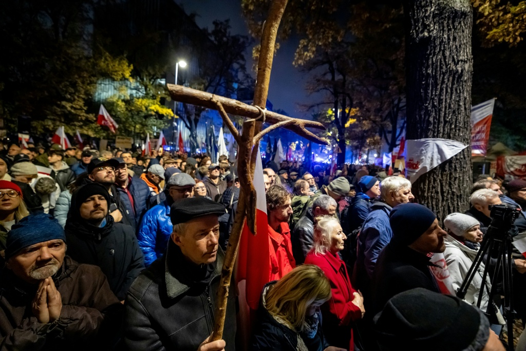 Some of those protesting said prayers while holding Roman Catholic rosaries and religious images — Wojtek RADWANSKI / AFP