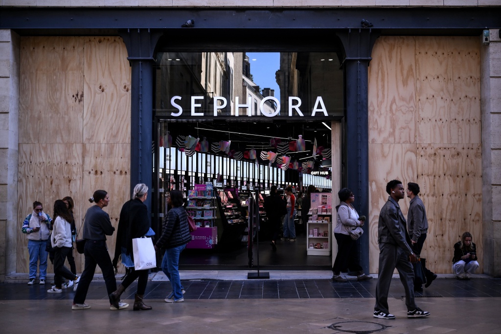 Many major brandname shops were targetted during looting on the sidelines of protests two weekends ago — Christophe ARCHAMBAULT / AFP