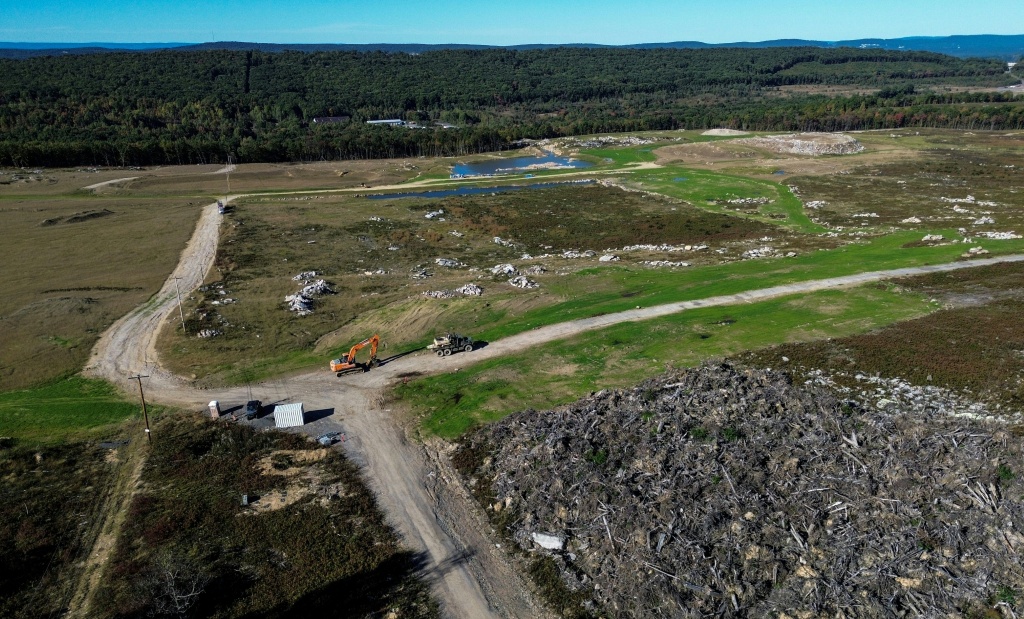 This aerial view shows the more than 1,200 acres (500 hectares) of land below the resort that were cleared to build the future server complex — Matthew Hatcher / AFP
