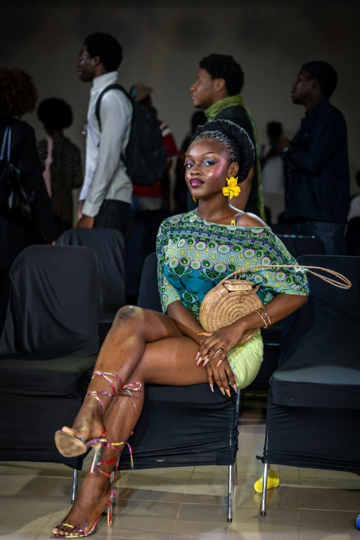 Guests and attendees bring their own style to Nigeria Fashion Week, which also hosts vendors selling handbags, menswear and leather goods for the general public — Light Oriye Tamunotonye / AFP