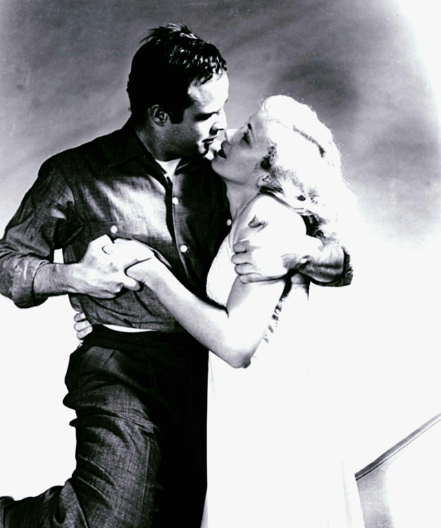Marlon Brando (L) holds Eva Marie Saint (R) in this file photo from  the 1954 Hollywood film 'On the Waterfront' — - / AFP