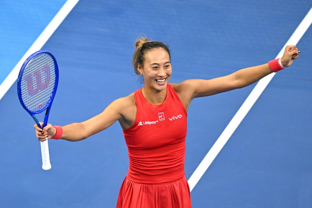 China's Zheng Qinwen celebrates beating Czech Republic’s Marie Bouzkova at the China Open tennis tournament in Beijing — Greg Baker / AFP