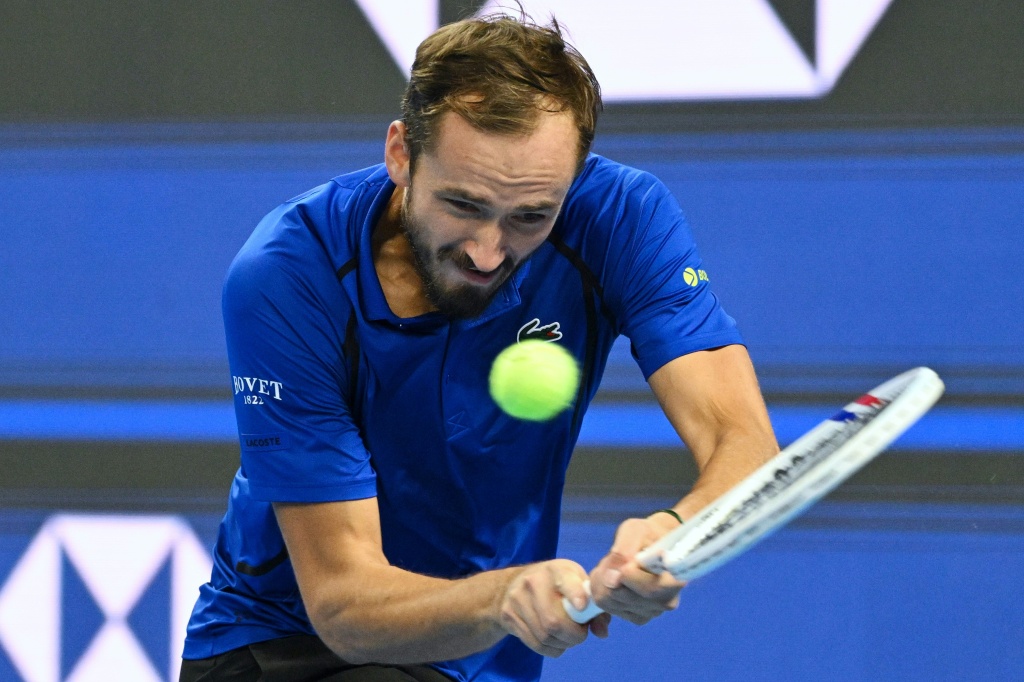 Russia's Daniil Medvedev hit the ball with a backhand into the stands after he failed to return a shot by Novak Djokovic in their China Open clash — Greg Baker / AFP