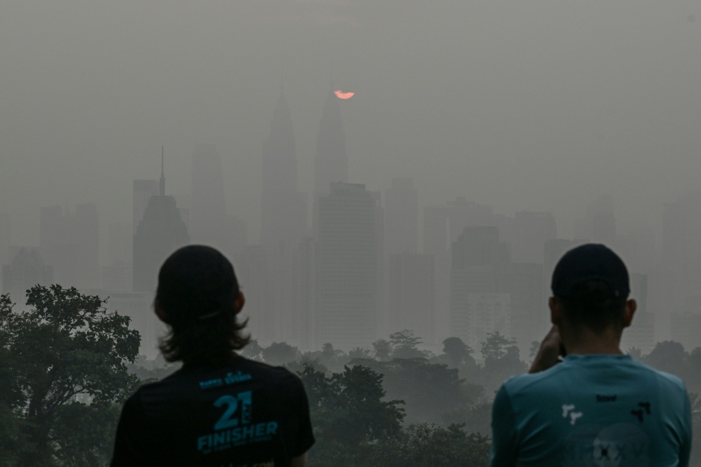 Residents in Kuala Lumpur called for something to be done as the months-long pollution disrupted daily life — Jam STA ROSA / AFP