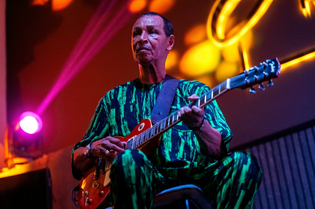 Orchestra Baobab rhythm guitarist Yahya Fall, 76, says the group's new music has a fresh vibe — SEYLLOU / AFP