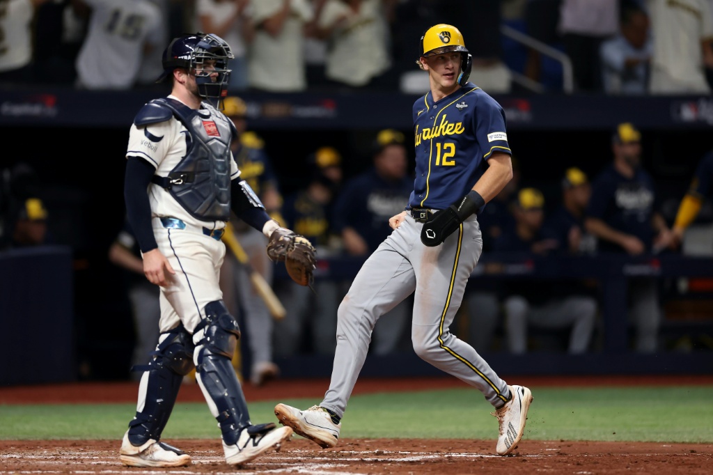 Milwaukee's Cooper Pratt scores a run in the Brewers' World Series-clinching win over the Tampa Bay Rays — ELSA