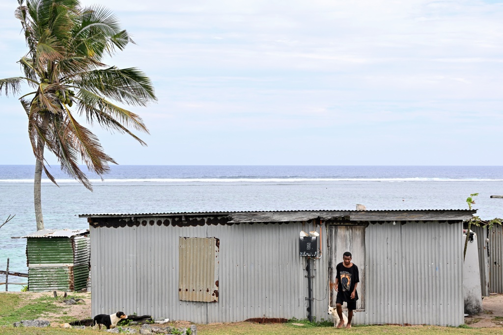 A villager leaves his house in the Naidiri Marine Biodiversity Park, a marine protected area about 52 kilometres from Nadi — Saeed KHAN / AFP