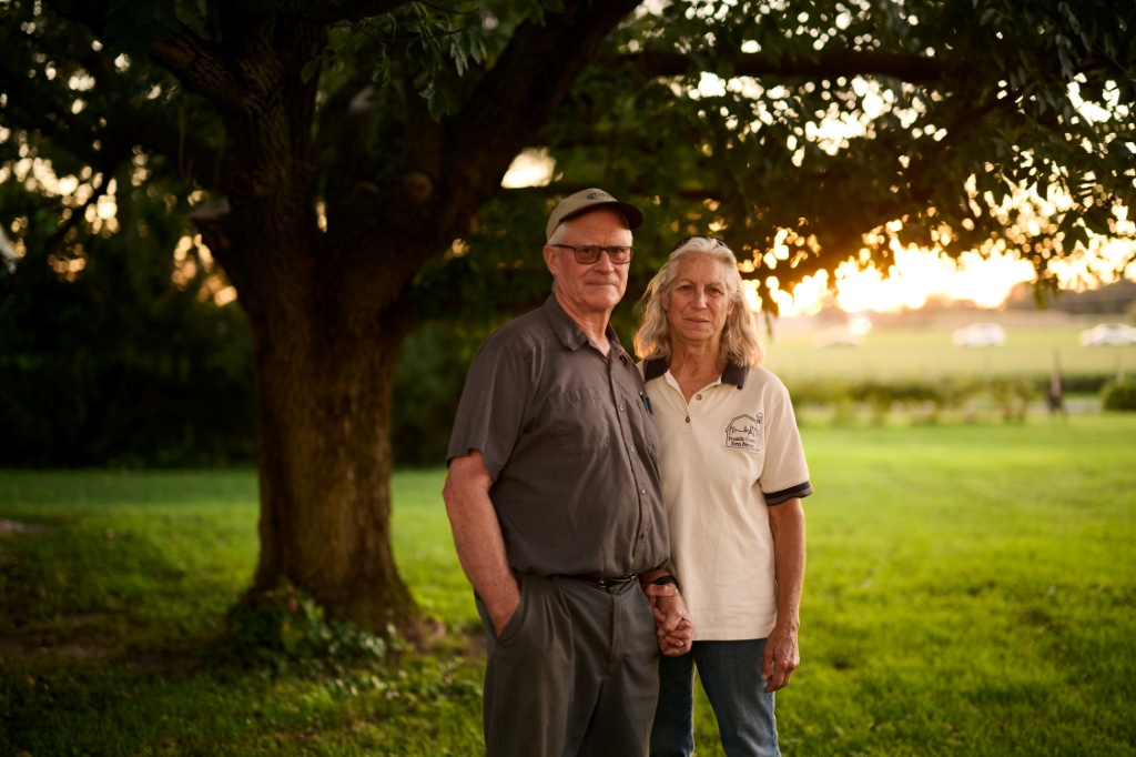 David Schacht and his wife Lisa Schacht expect many farmers may still back Republicans despite higher costs — DUSTIN FRANZ / AFP