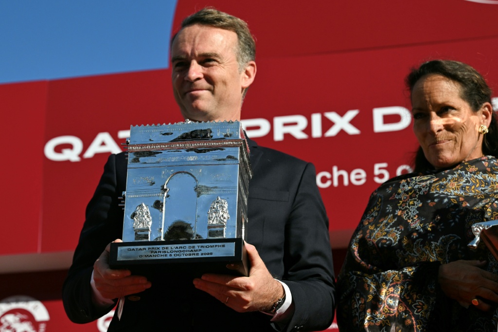 Francis Graffard (L) believes Daryz is the best horse he has trained — Anna KURTH / AFP