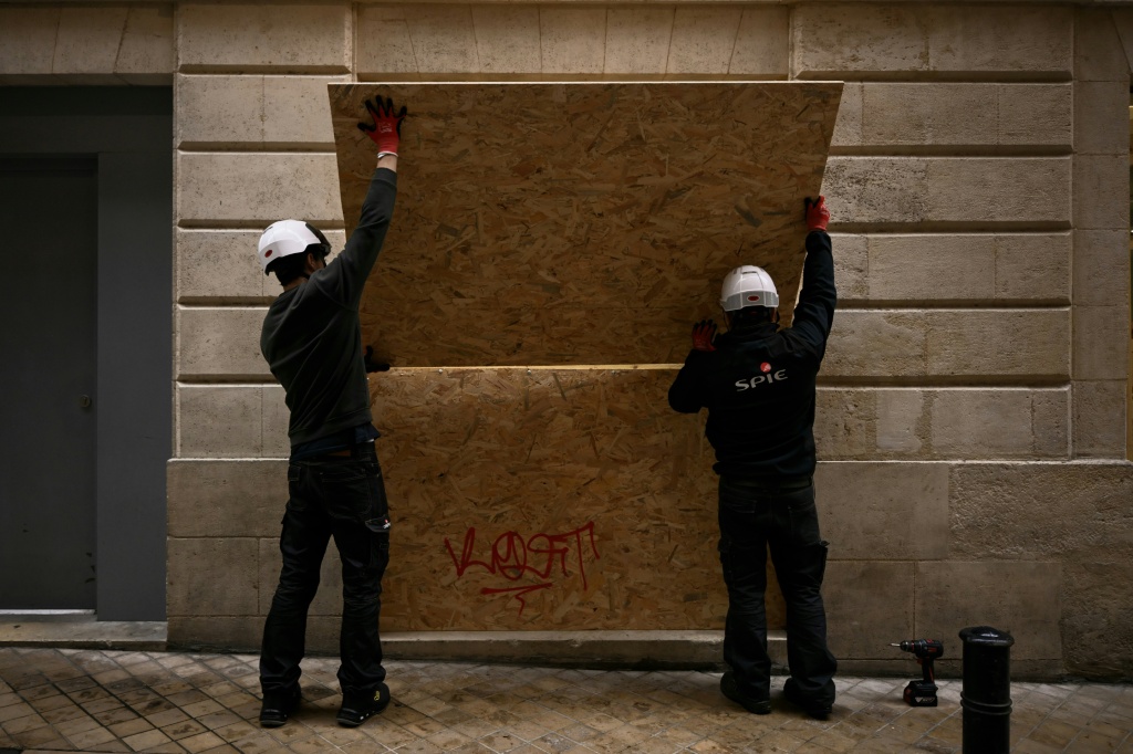 Prosecutors said a 66-year-old man was arrested over the arson of a 19th-century town hall in Limoges during the riots — PASCAL LACHENAUD / AFP