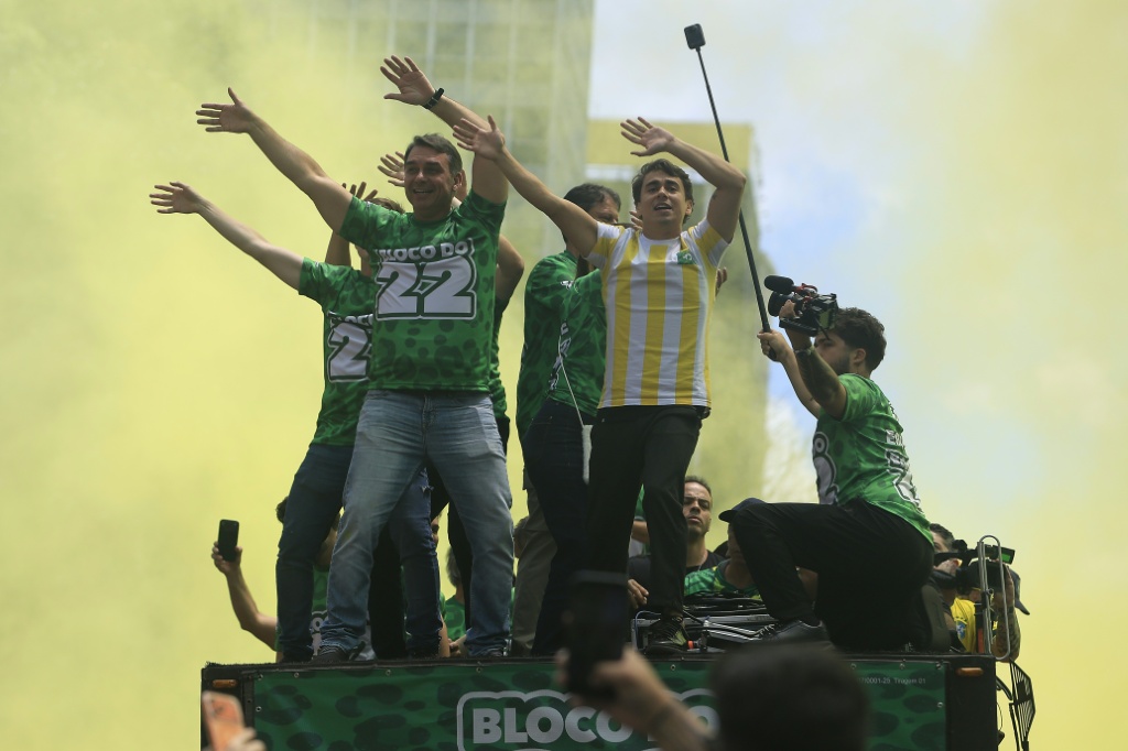 On the campaign trail, Bolsonaro displayed the relaxed Carioca style and language that the city of Rio is known for, dancing to funk music along with young right-wing influencers — Miguel SCHINCARIOL / AFP