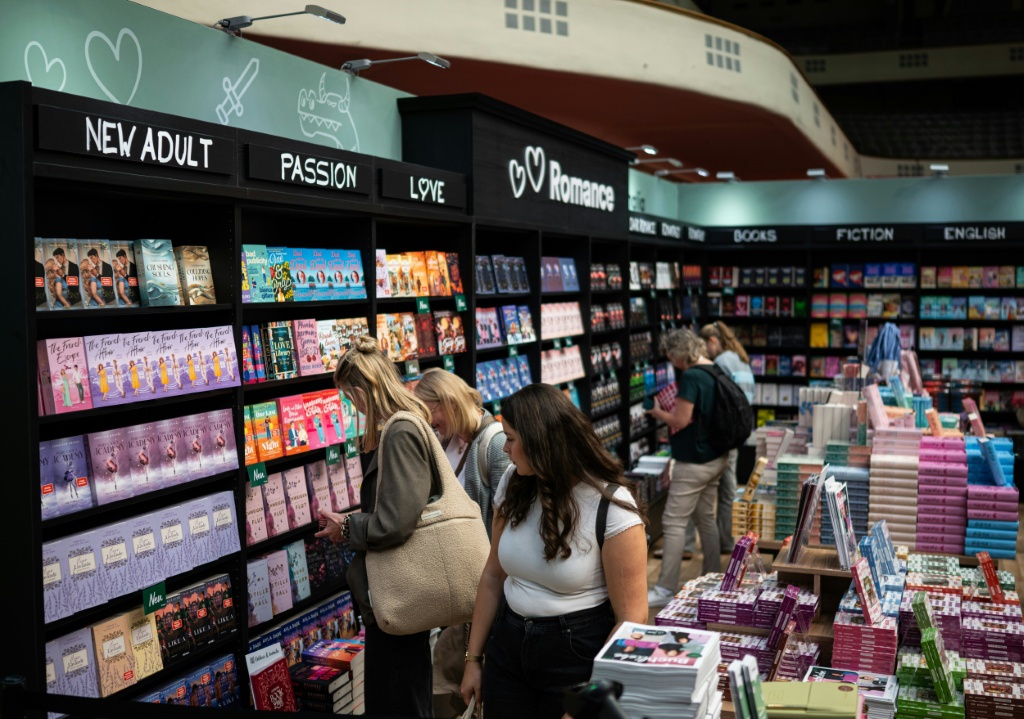 Visitors browse bookshelves at the Frankfurt Book Fair — Hannes P. Albert / AFP