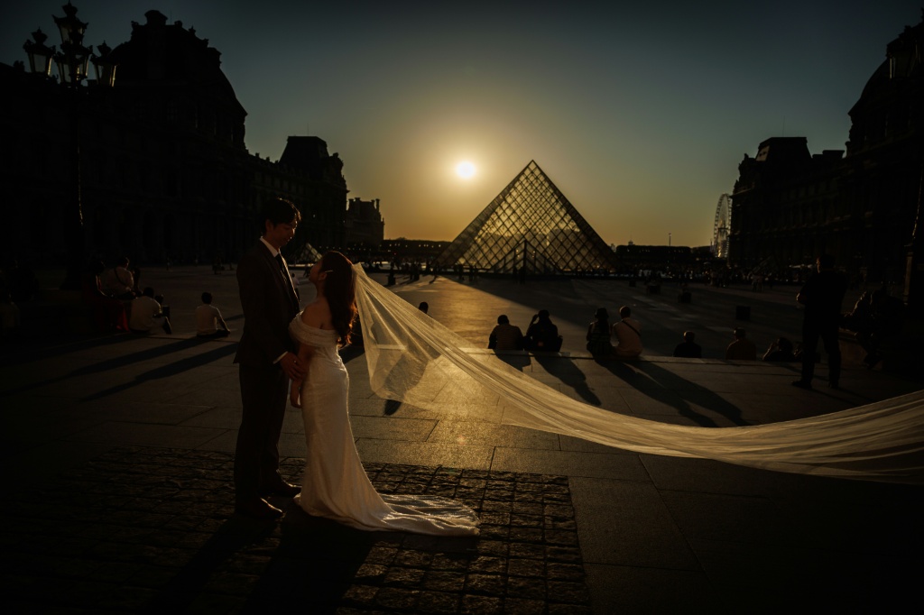 The glass Pyramide du Louvre was designed by Chinese-US architect Ieoh Ming Pei — Simon WOHLFAHRT / AFP
