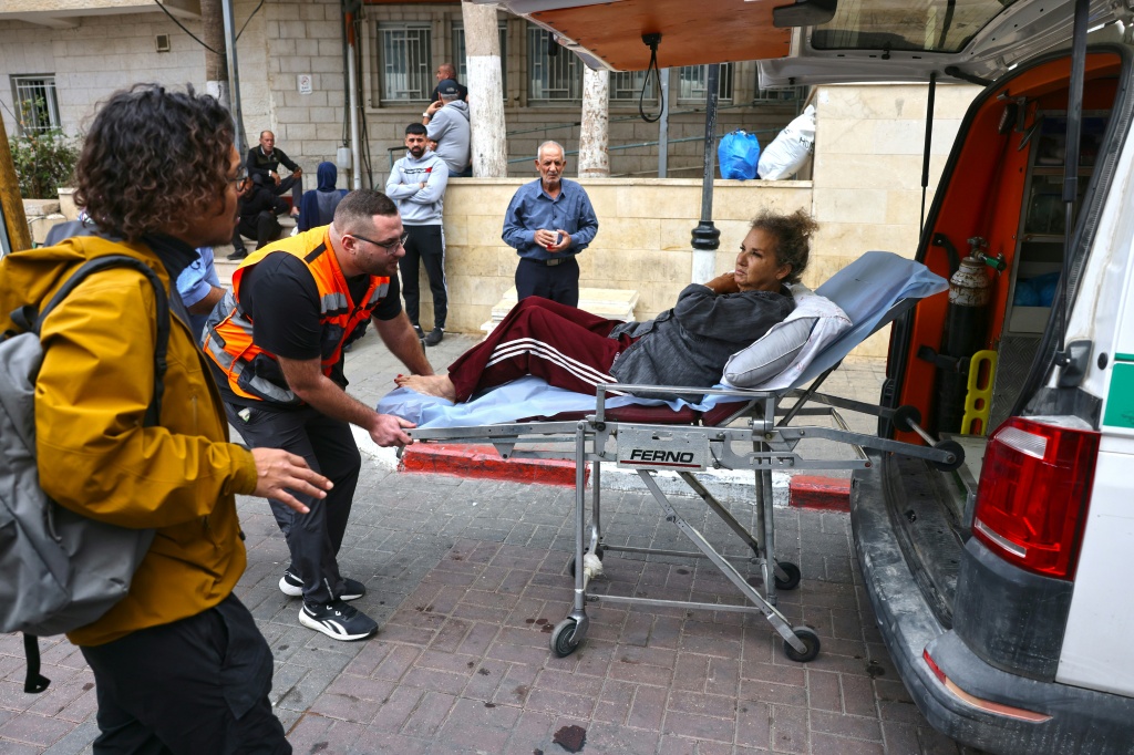 American photojournalist Heidi Levine is transferred on a stretcher into a Palestinian ambulance in Ramallah — AHMAD GHARABLI / AFP