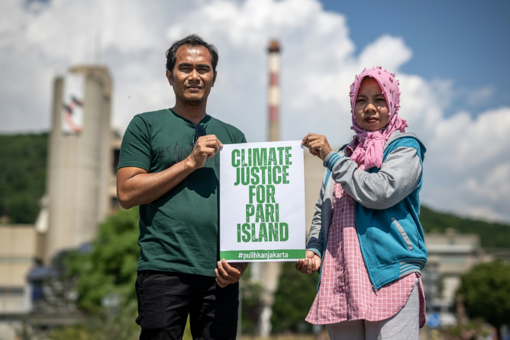 Residents of Indonesia's Pari Island sued cement maker Holcim in Switzerland in 2025 over its contribution to climate change and rising sea levels; a Swiss court allowed the case to proceed — Fabrice COFFRINI / AFP