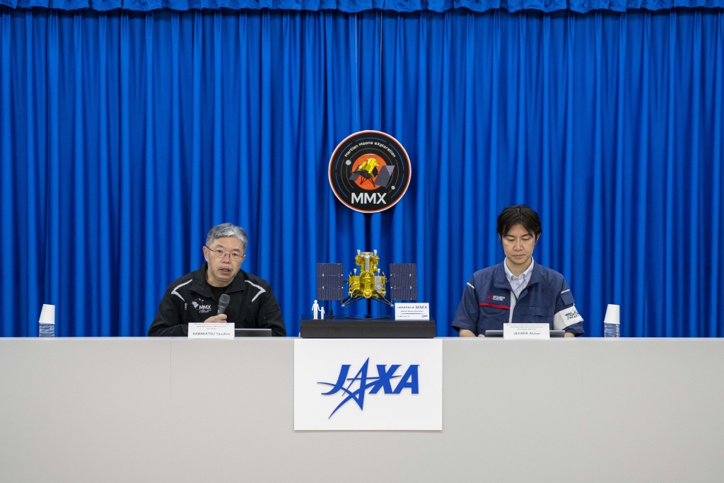 Yasuhiro Kawakatsu (L), project manager of the Mars Moons eXploration (MMX) mission, attends a press conference at the Tanegashima Space Center in Minamitane, Kagoshima prefecture on August 13, 2026 — Yuichi YAMAZAKI / AFP