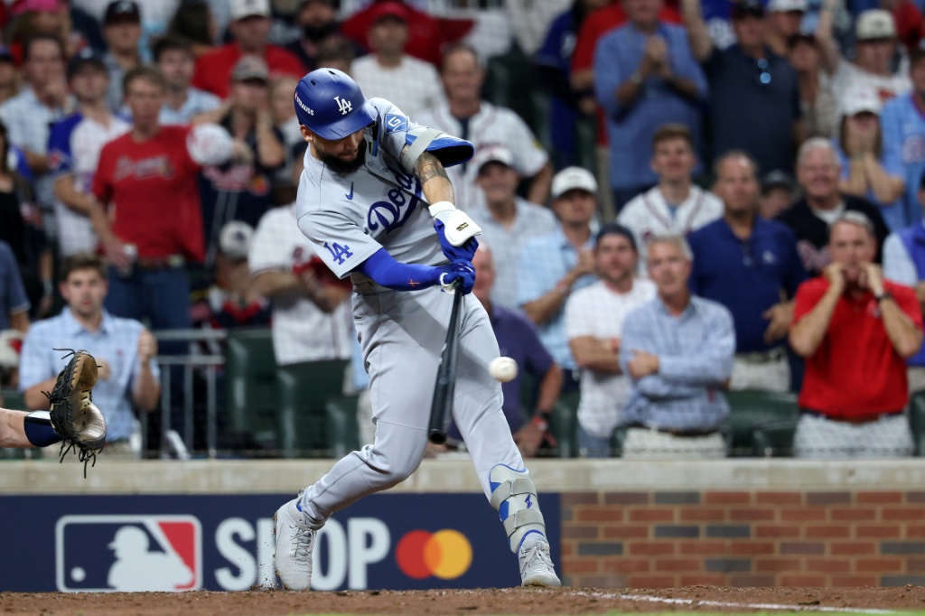 Andy Pages of the Los Angeles Dodgers hits a two-run single in a victory over the Atlanta Braves that saw the World Series champion Dodgers advance in the MLB playoffs — Kevin C. Cox