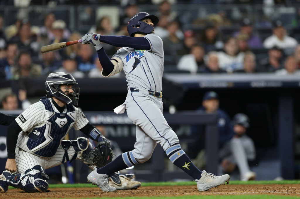 Victor Mesa Jr. of the Tampa Bay Rays hits a two-run home run against the New York Yankees in game three of their MLB playoff series — Sarah Stier