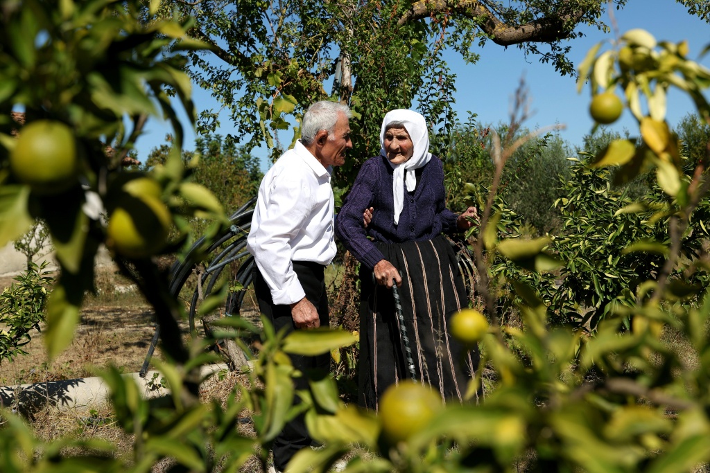 Surrounded by fruit trees, she has spent almost her entire life in the village — Adnan Beci / AFP