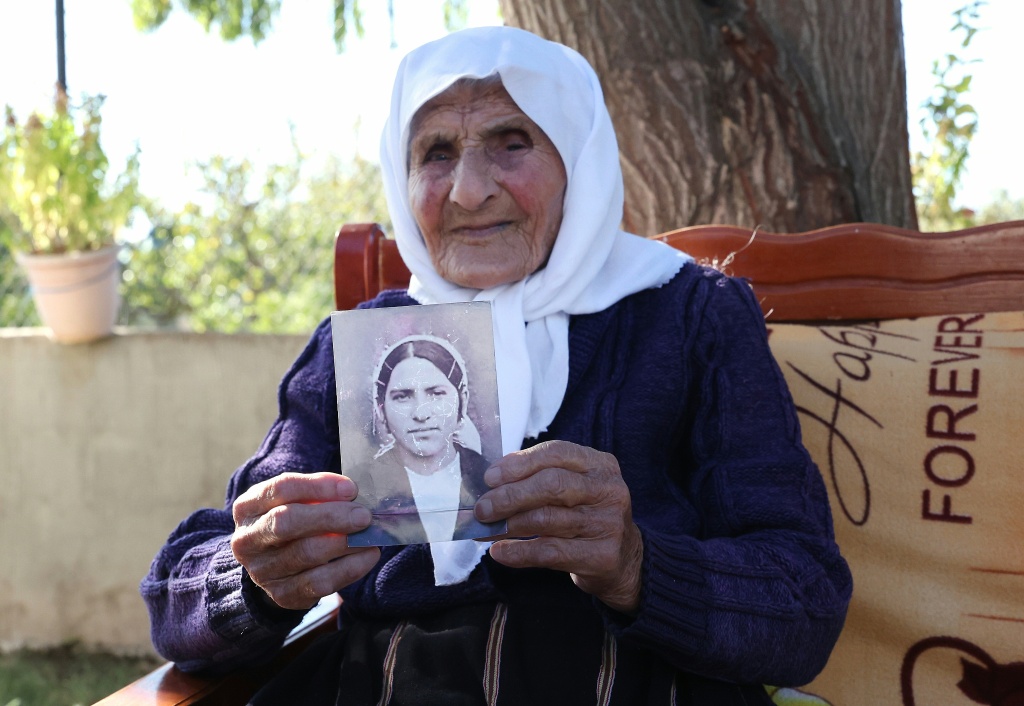 From her own youth, she has kept a single photograph — Adnan Beci / AFP