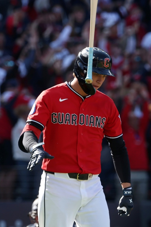 Cleveland's Petey Halpin tosses his bat into the air after hitting a home run in the fifth inning against Tampa Bay in an MLB playoff victory — Gregory Shamus