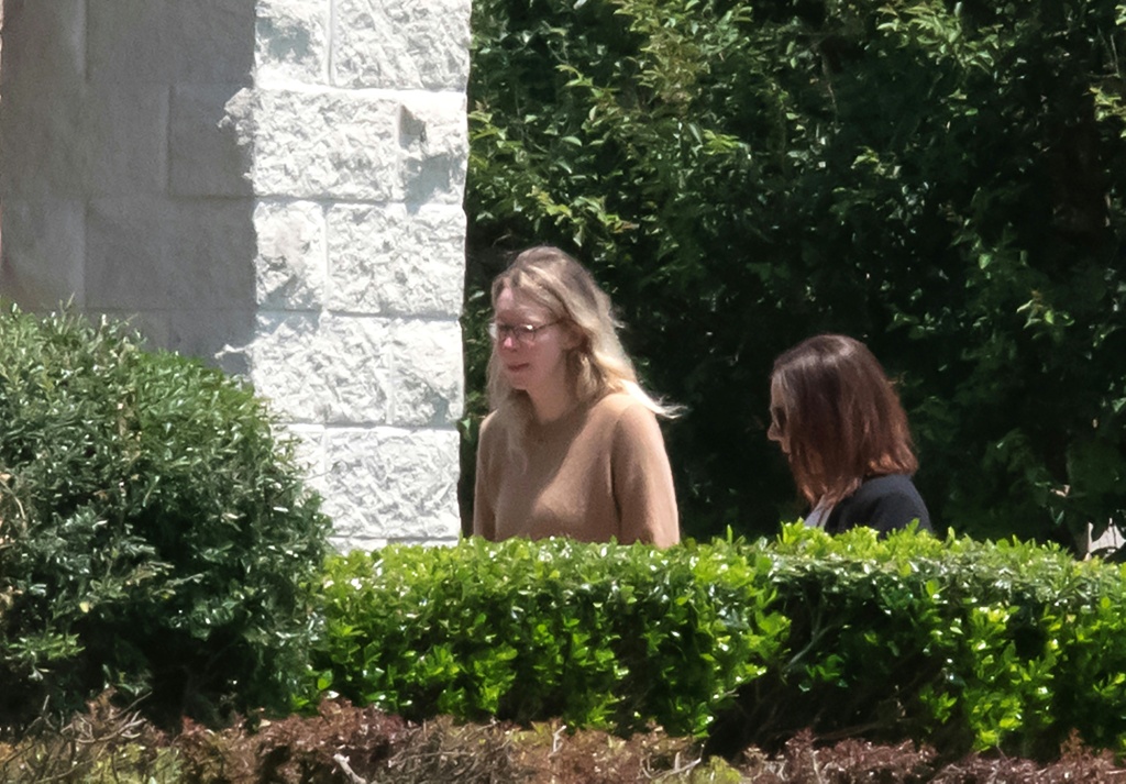 Theranos founder Elizabeth Holmes (L) arrives at a federal prison in Bryan, Texas, on May 30, 2023 — Mark Felix / AFP