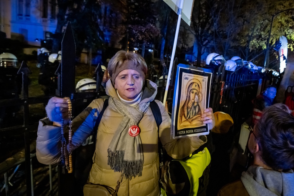 Some of those protesting said prayers while holding Roman Catholic rosaries and religious images — Wojtek RADWANSKI / AFP