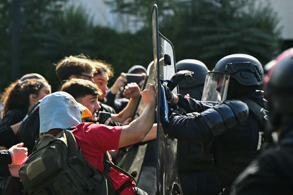 There were scuffles with police in Paris — LOU BENOIST / AFP