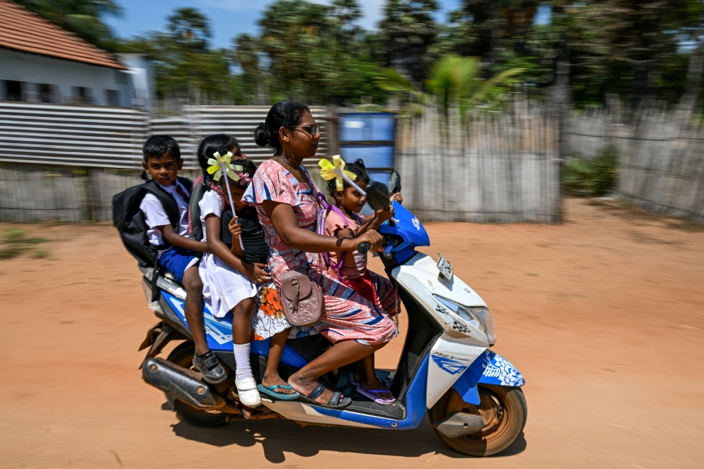 Benedict Mary Vijiliya's village, around 100 metres (330 feet) from the coast, is surrounded by wind turbines which she believes have impacted water drainage — Ishara S. KODIKARA / AFP