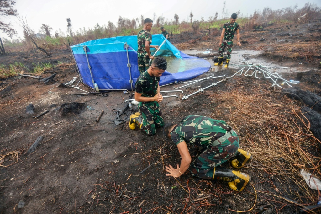 Rains bring relief to Indonesian city weary of fire haze