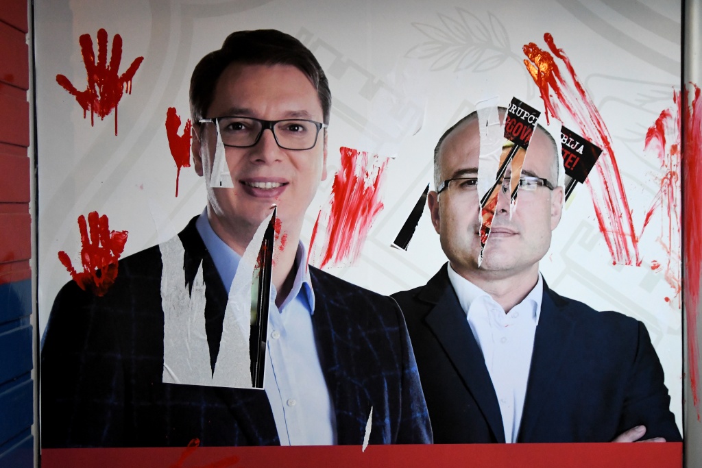 Vandalised portraits of  President Aleksandar Vucic and Prime Minister Milos Vucevic during a protest in Novi Sad — Nenad MIHAJLOVIC / AFP