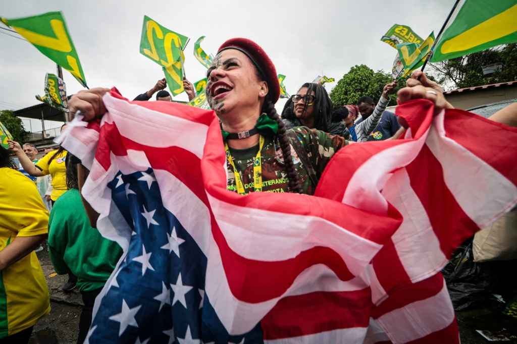 Trump has loomed large over the campaign, and said he is 'very closely' watching the election, but he has not endorsed Flavio Bolsonaro — Douglas SHINEIDR / AFP