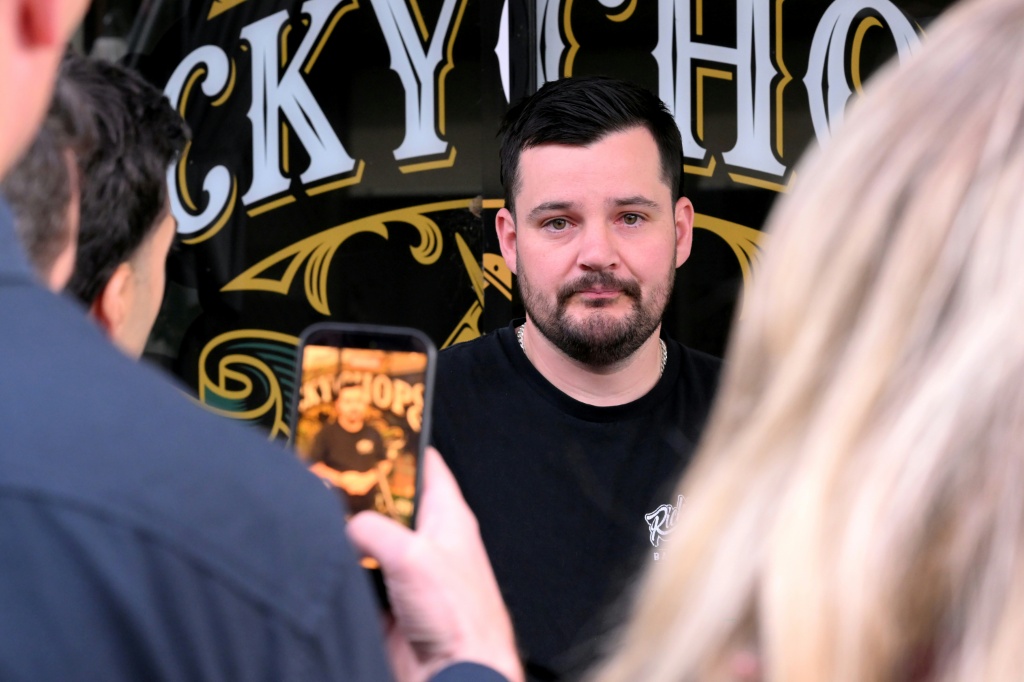 Barber Ricky Jefferies speaks to the media a day after tackling a man who attacked Australian politician Helen Haines in the northern regional city of Wangaratta, about 250 kilometres north-east of Melbourne on October 20, 2026 — William WEST / AFP