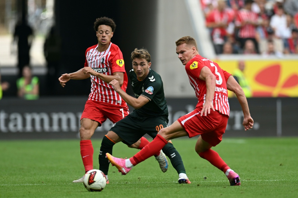 Freiburg's Derry Scherhant (L) was called up to the Germany squad for the first time this season — THOMAS KIENZLE / AFP